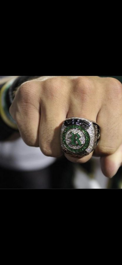 Carlitos+Nu%C3%B1uz%2C+junior+varsity+football%2C+and+baseball+star+flaunts+his+new%2C+sparkly+CIF+ring+during+Royal+v.+Oak+Park+halftime.+Baseball+had+a+24-6+record%2C+just+falling+short+in+the+state+championship+game.+Lets+run+it+back%2C+and+get+another+one%21+Nu%C3%B1ez+shouted+after+receiving+his+ring.