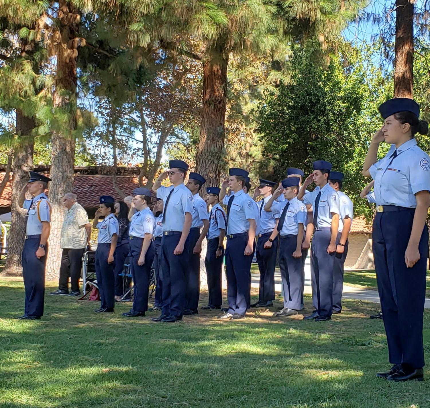 AFJROTC students stand at attention. 