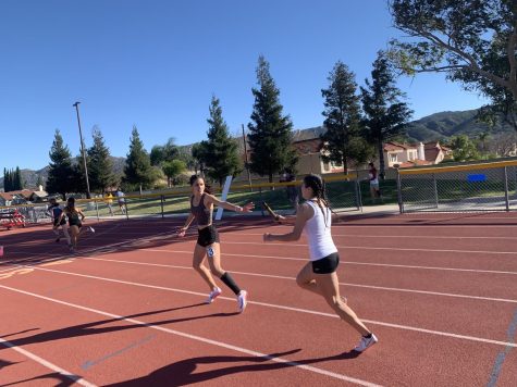 Jennyfer Hernandez, junior hands the botton to the anchor, Janet Gonzalez whos a senior to finish the sprint medly relay. At the time of hand off the team was in third but Janet gets the team in second place. Qualifying for the Winter Championships finals.