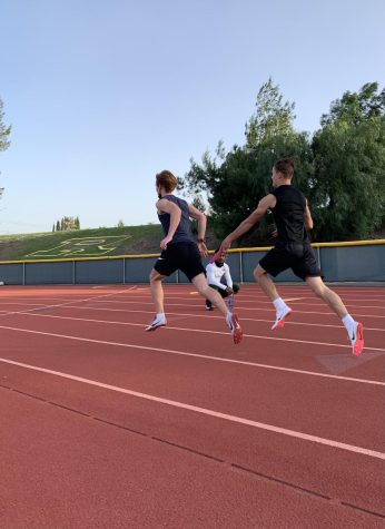 As the season is approaching, perfect handoffs between teammates Ethan Bettes and Tristen Barth are crucial in order to perform excellently in their track events. Relay races rely heavily on exchanges between the athletes. 