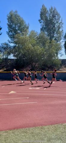 Royal JV girls pushing through in the 4x100 relay at a tri-valley meet with Moorpark and Simi High Schools. 