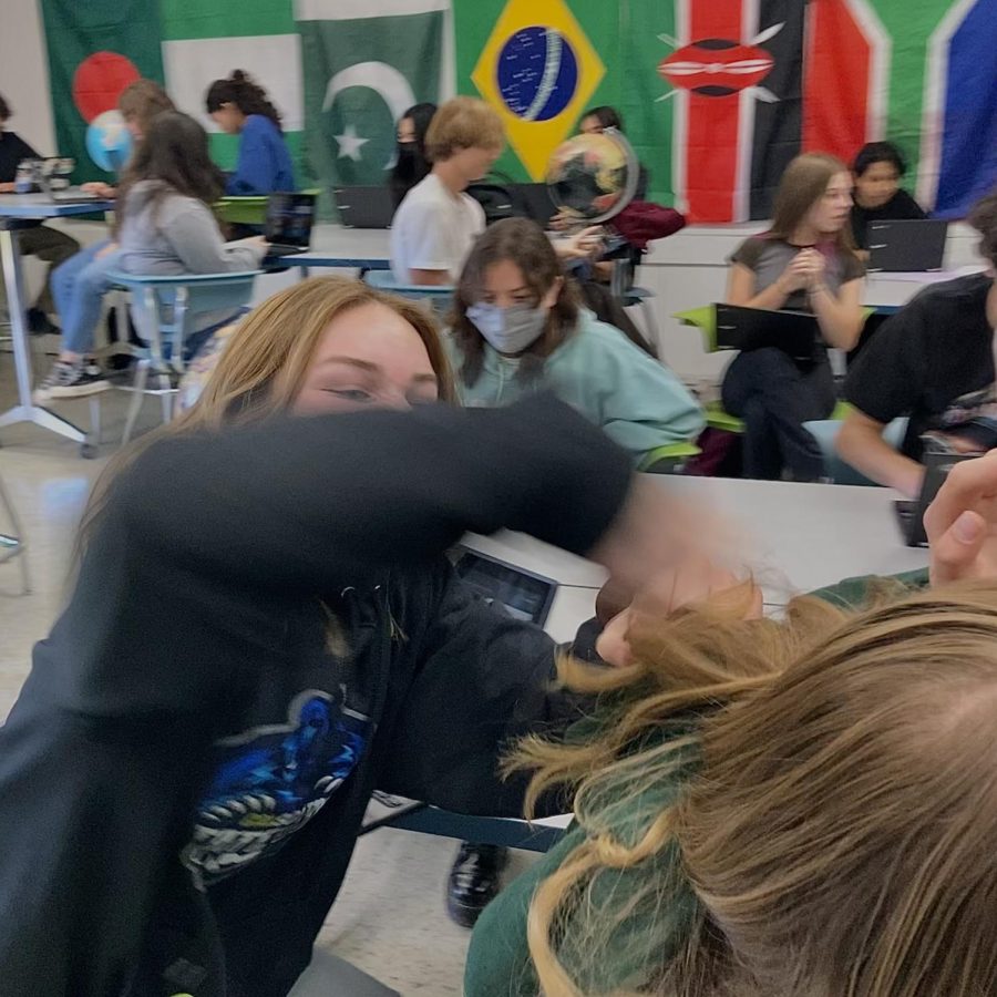 Following the AP Human Geography exam on May 5, AP Human Geography and World History teacher Brian Dennert prepares his students for their upcoming AP World History course. To do so, students play a tense game called GimKit to familiarize themselves with the material for the class's summer homework. Depicted are freshman Stevie McGrath and Emily Albert getting heated over a high-stakes match of the fun new educational game.
