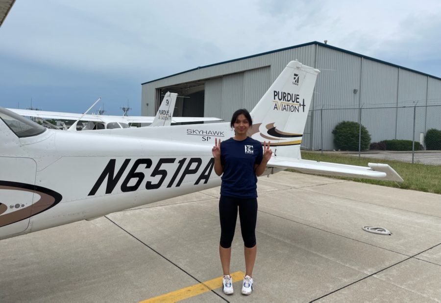 Hiral Choudhary (Corps Commander of AFJROTC) next to the Cessna 172s, the aircraft she flew.