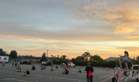 Marching Band practices competition material in West Parking Lot during Band Camp.