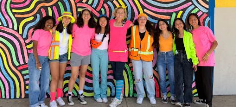 Assistant Principal Ms. Myszkowski with students decked out in neon for Neon Day.