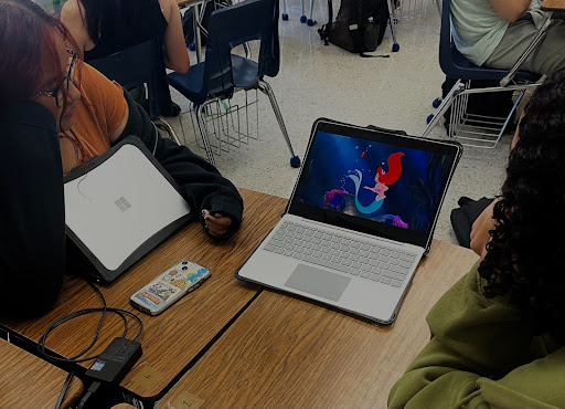 Seniors Martha Rodriguez and Riley Marshall watching Disney’s animated film The Little Mermaid.