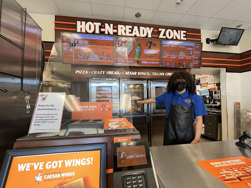 Little Caesars employee and former Royal High School student Jose Esparaza hard at work. 