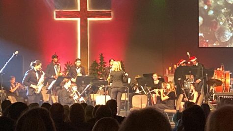 Our very own Wind Ensemble playing a Mariah Careys Christmas All I Want For Christmas Is You at Cornerstone Church, while the audience enjoys the holiday feeling.