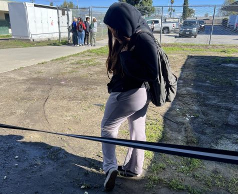 Junior Jasmine Gonzalez tried to get out of the lunch line, but on the way out stepped on a muddy spot which was left by the rain.


