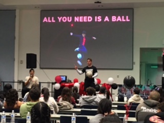 Alex Mendoza, freestyle soccer champion, sharing tricks with his partner on stage during his presentation to Ventura County high school students.