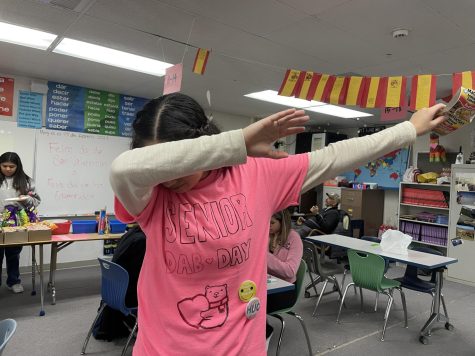 Senior Andrea Munoz wearing her senior hug day shirt, that Munoz had her senior friends sign.