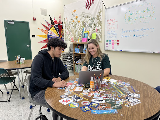 Mrs. Cuneo giving advice to junior Oscar Catalan regarding colleges.