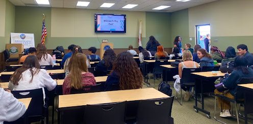 Members of the Key Club gather in the CSI room during lunch, waiting for the meeting to start.