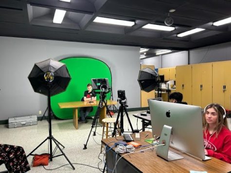 Students in the process of filming weekly video announcements during third period. 