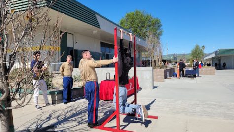 Senior Sean Nelson attempts to do pull-ups for the Marines.