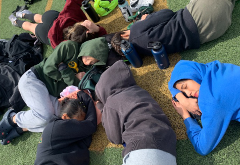 Sprinters Seniors Ashlyn Holland, Valerie Montalvo, Kiara Aguilar, Juniors Emily Nguyen and Jennifer Sanchez, along with Freshman Katie Ju taking a nap right after they had just finished running the girls 100 meter dash.