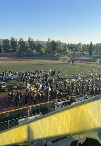 Band performing for an enthusiastic audience prior to the start of the football game.