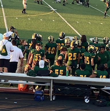 Senior linebacker Aiden Krause trying to keep the other linebackers motivated during the first quarter of the game.