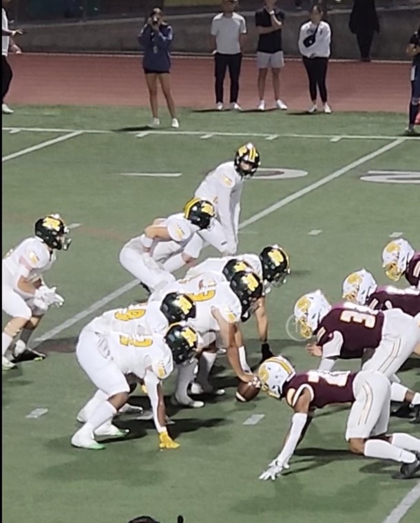 Royal and Simi Valley football teams line up for the first play against each other in 2023.