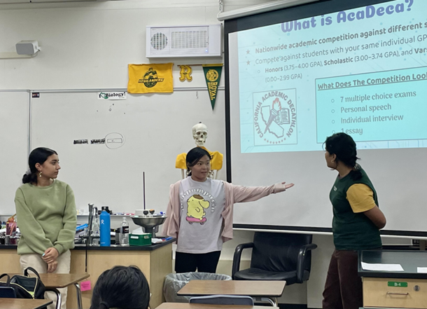 Simran Dhillon, Karen Troung, and Priyal Choudhary share a slide presentation during the first Academic Decathlon meeting of the year.
