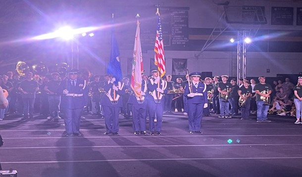 Our JROTC standing with honor as we sang our National Anthem. 