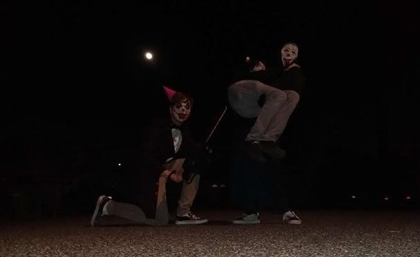 Three teens having a good old spooky time on Halloween.