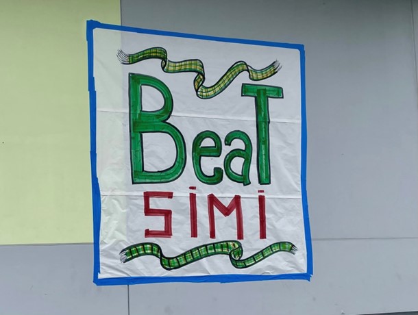 Poster put up for students to take pictures in front of for Beat Simi Day.