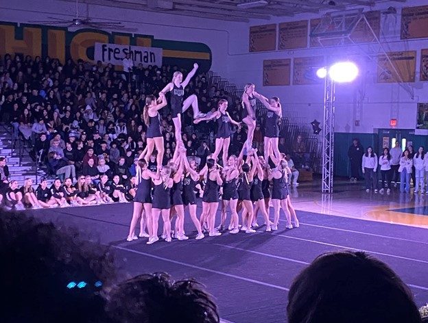 The cheerleaders performing during the winter rally.