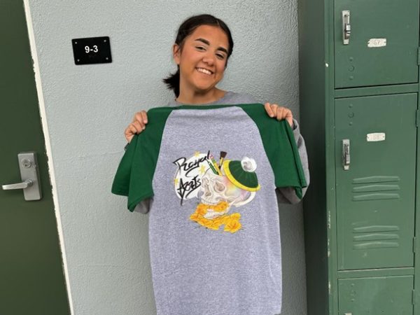 Senior ROP Web Design student Rosalynd Valenzuela showing off the official t-shirt her class created.