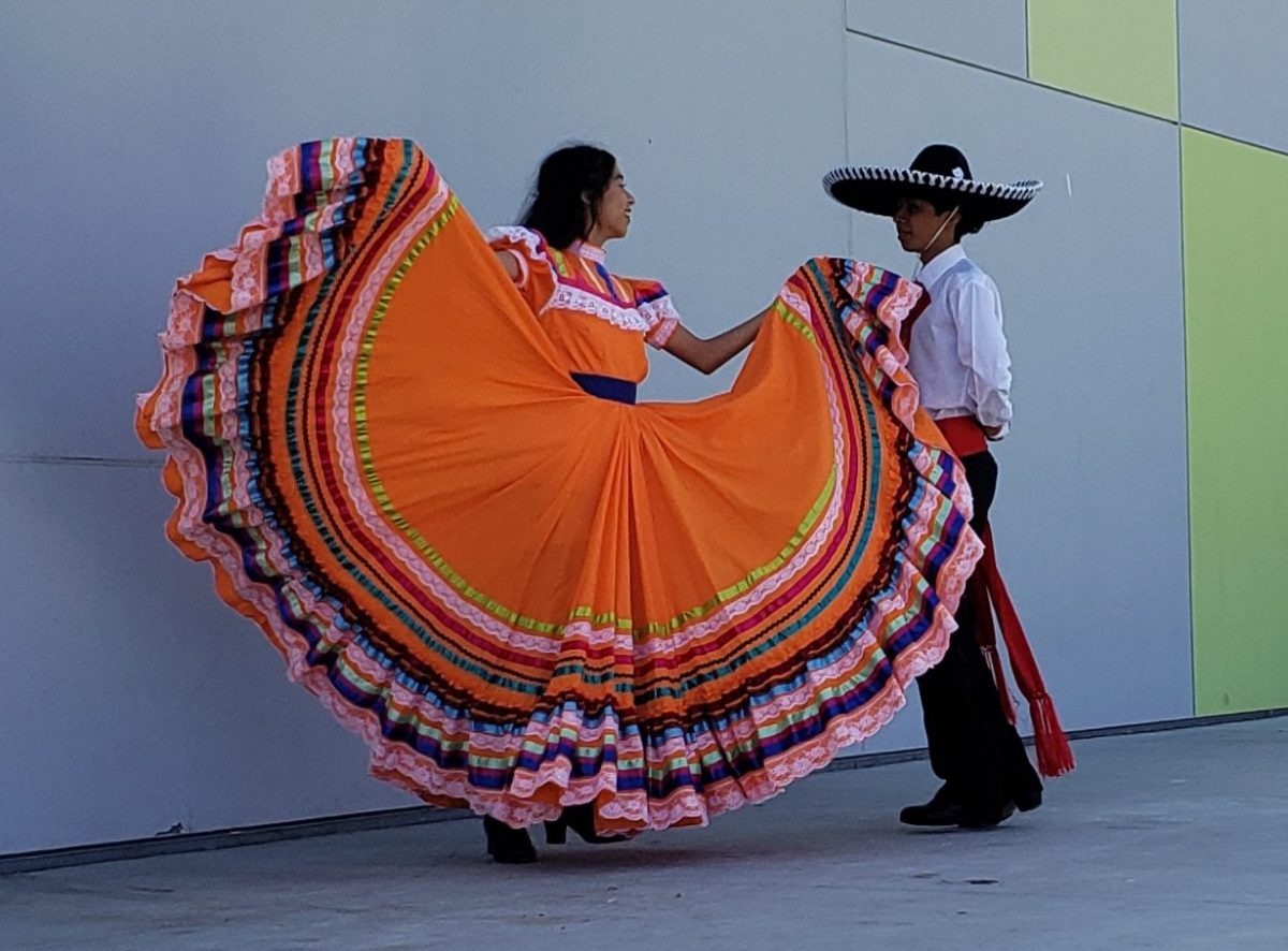 Spanish dancers Stephanie Valencia and Zachary Lopez performing during lunch, and dazzling the crowd with their moves and colorful clothing.