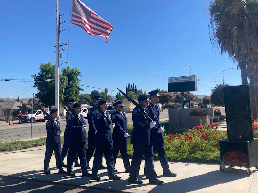 AFJROTC marching back after raising the flag to half-mast.