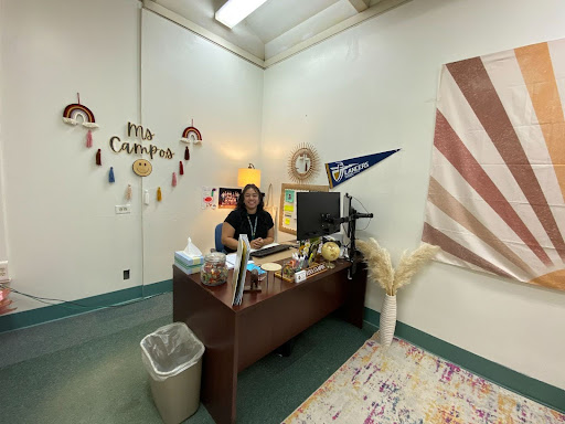 Mrs. Campos the new College & Career Counselor sitting at her desk ready to help students.