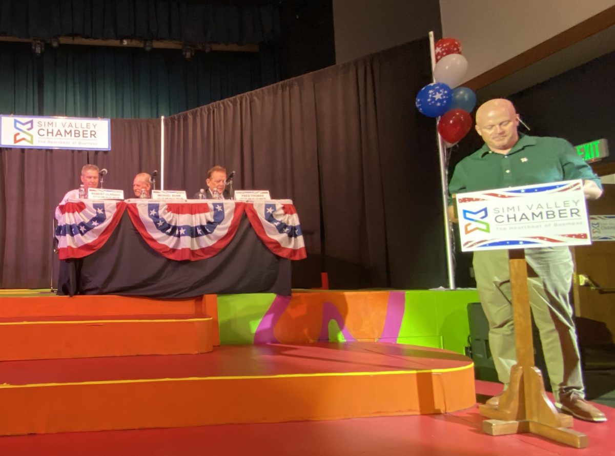 Moderator Mr. Brian Dennert preparing questions for the three candidates for Simi Valley Mayor. 