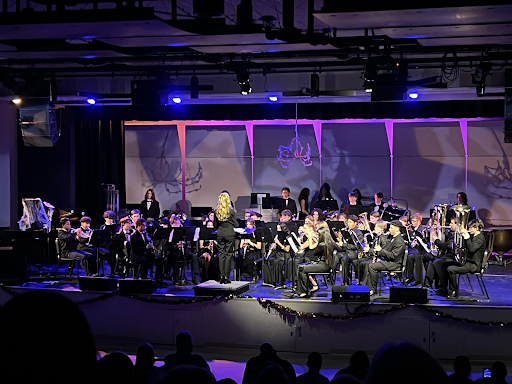 The Wind Symphony performing the first song of the concert, Music for a Darkened Theatre, arranged by Michael Brown, with Mrs. Lisa Pate directing. 