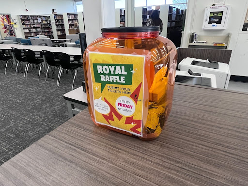 Raffle bin filled with positivity tickets located in the library.