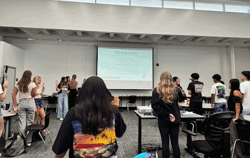 Key Club members start the meeting with saying the Key Club Pledge.