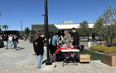 Bryan Gittiens, CSUN recruiter, explaining to students the various classes and opportunities within the university.