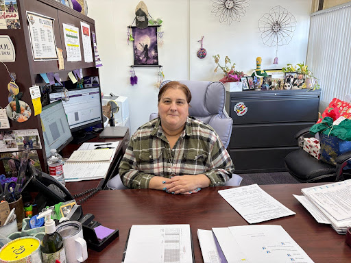 Ms. Ashley Rotellini organizing the Holiday Fundraiser for the Sunshine Club.