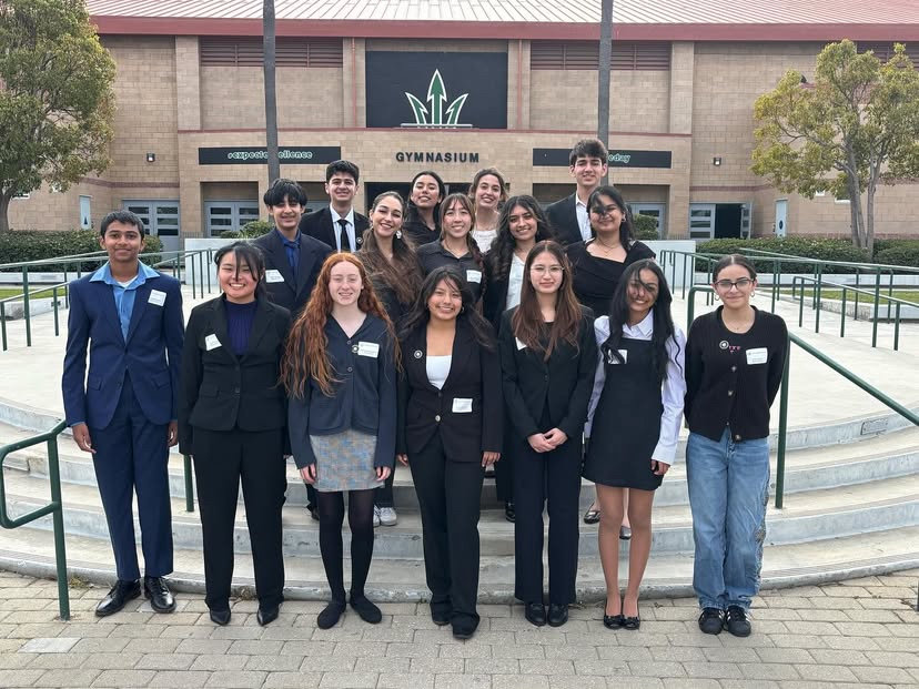 The Academic Decathlon team, dressed in classy business casual, now ready to take on the Super Quiz.