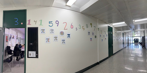 The wall covered with numbers of Pi and the symbol. 