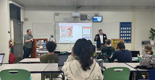 Judge Roger Lund speaks to an economics class on law and governance.