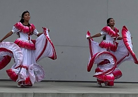 Junior Stephanie Valencia and freshman Ariana Lepe perform a traditional Baile Folklórico on stage during the school’s Cinco de Mayo celebration.